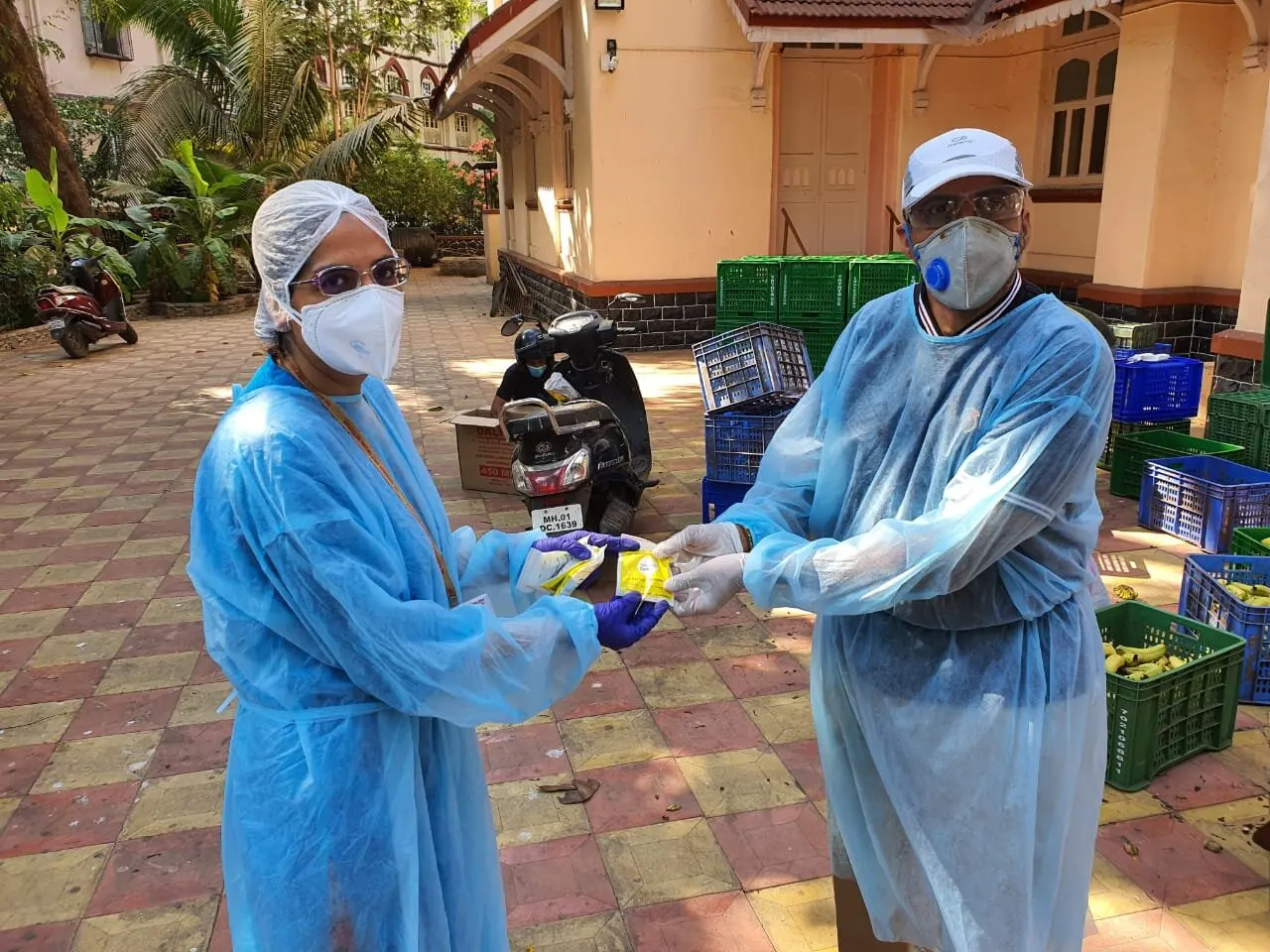 Immunity kits being handed over to healthcare workers in PPE