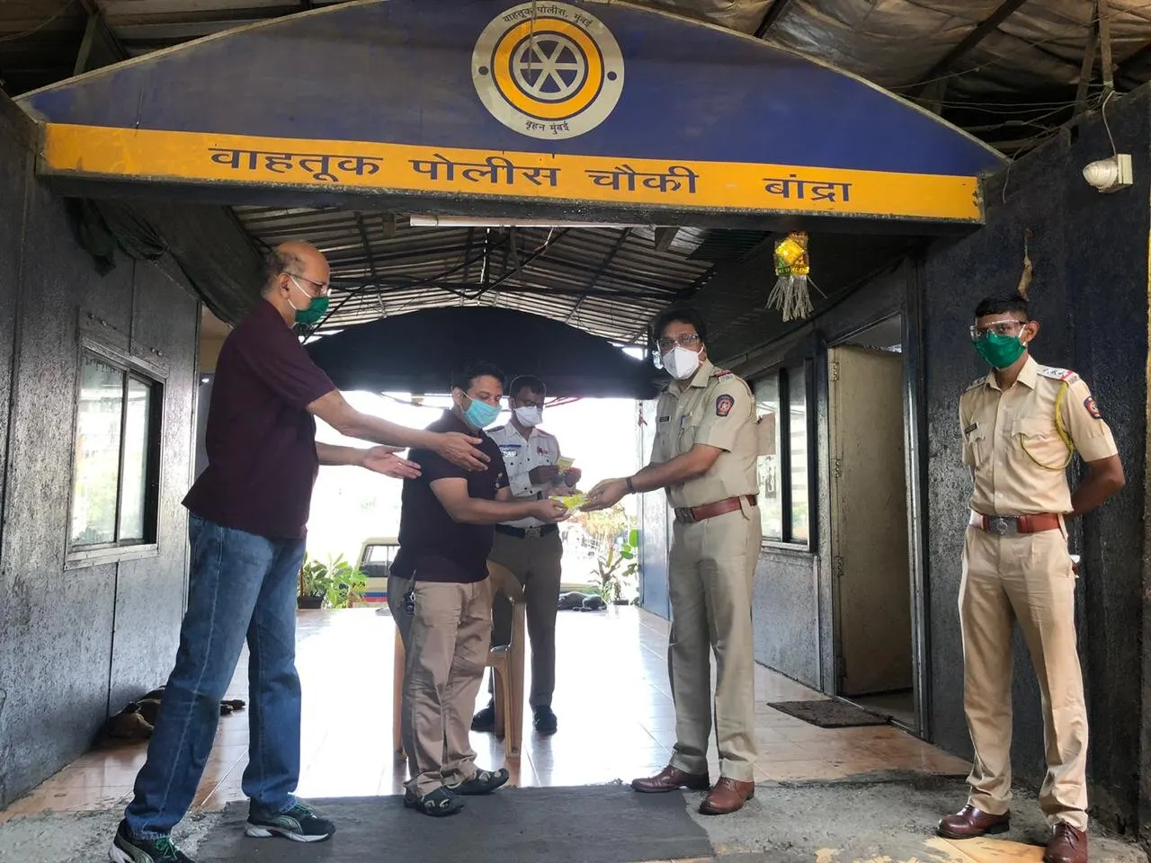 Immunity kits handed over at a police station entrance
